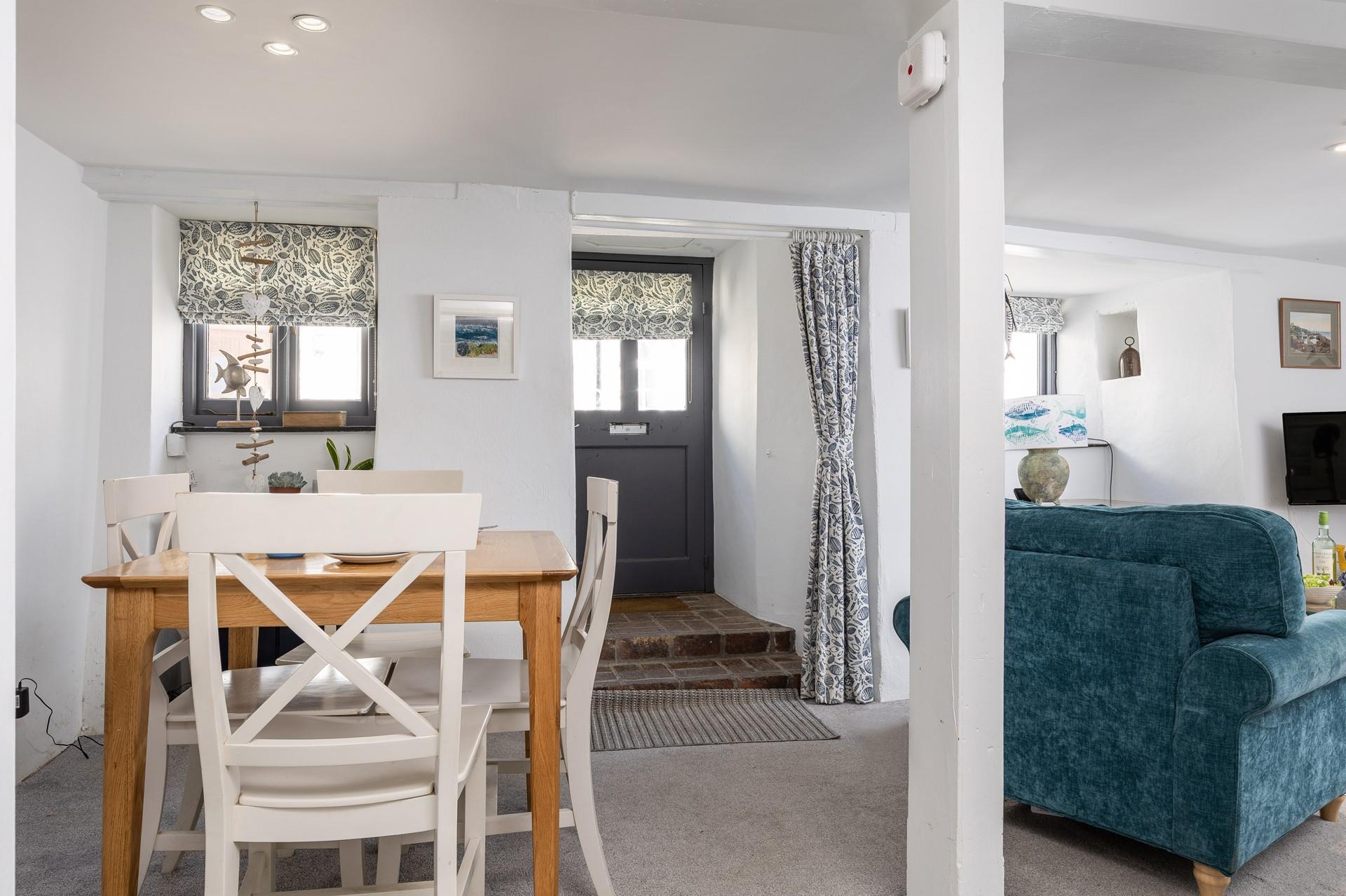 The open plan living area includes a dining table.