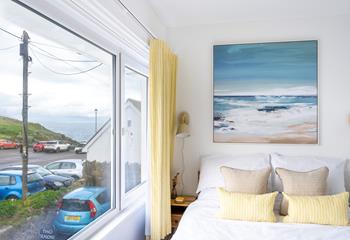 We love the contemporary seaside artwork above the bed!