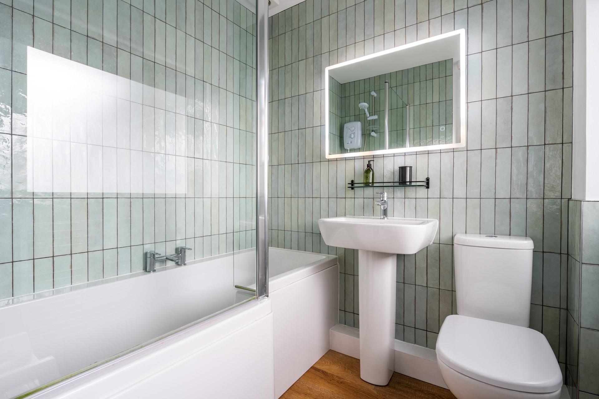 We love the shell-like tiles in the family bathroom. 