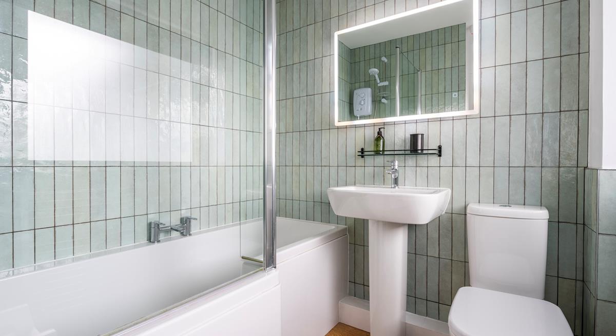 We love the shell-like tiles in the family bathroom. 