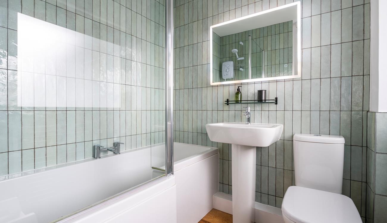 We love the shell-like tiles in the family bathroom. 