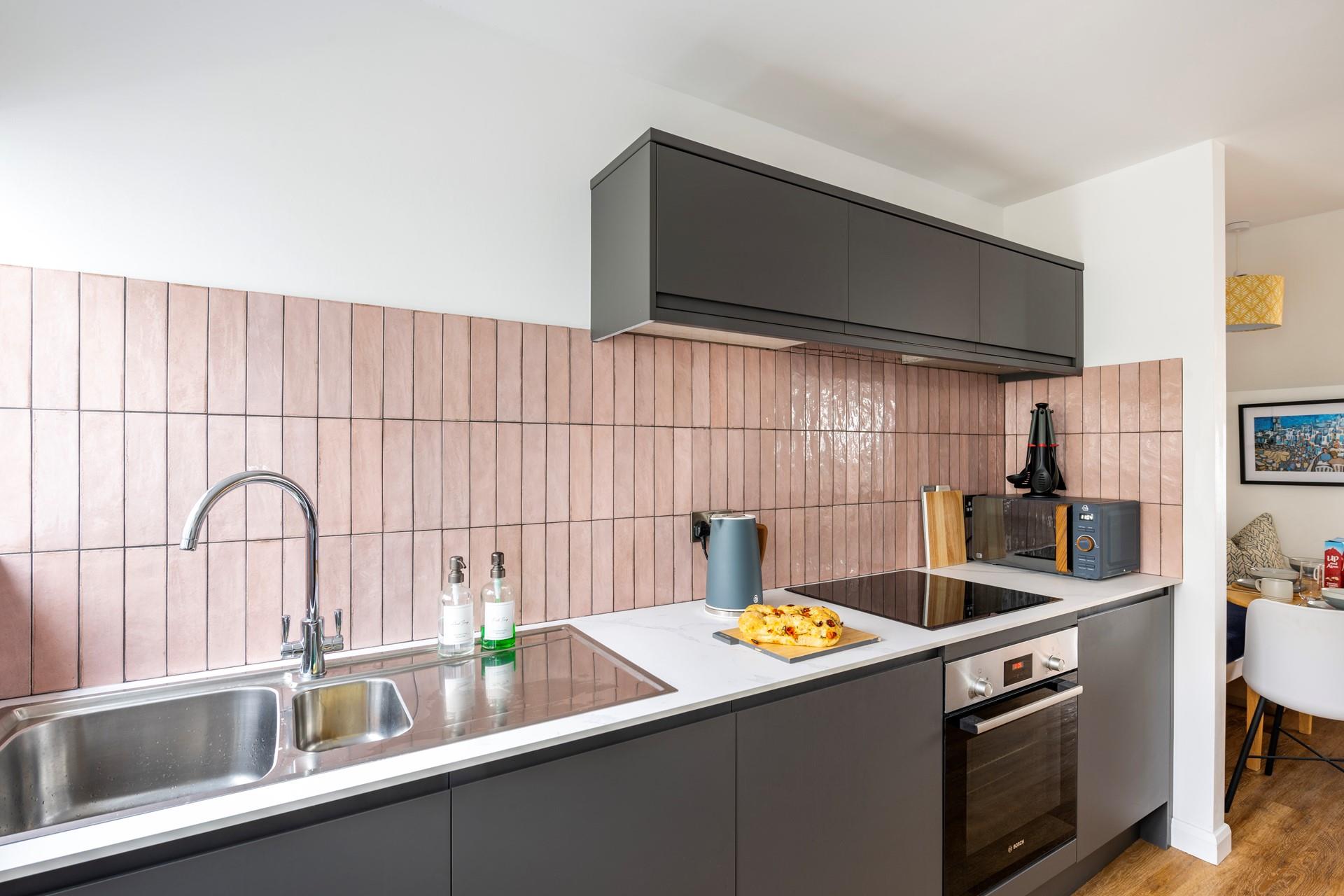 Sleek and stylish, you'll love cooking up a feast in the kitchen at No 5 Beach Court. 