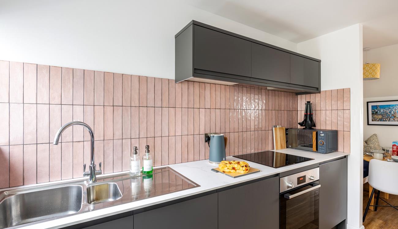 Sleek and stylish, you'll love cooking up a feast in the kitchen at No 5 Beach Court. 