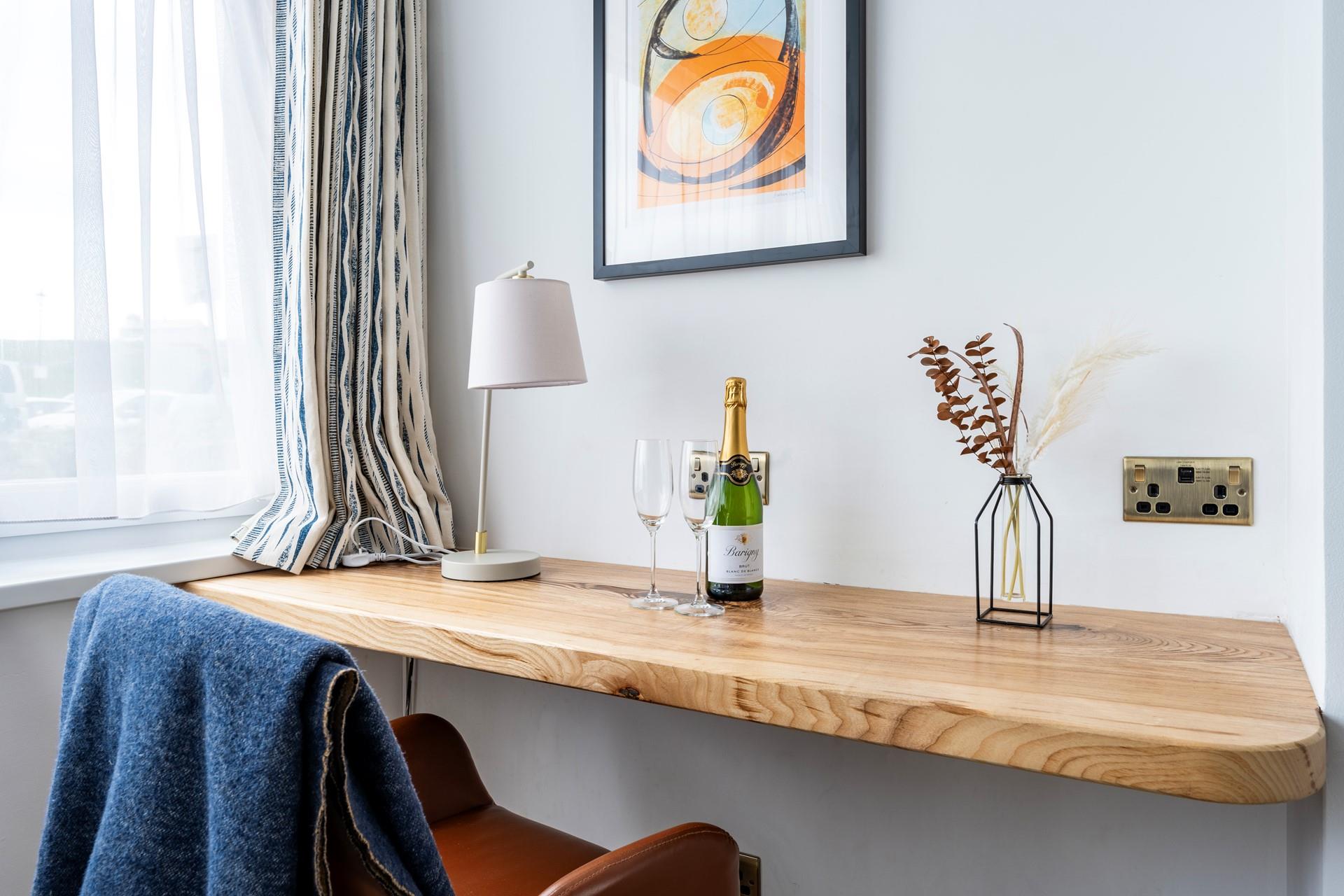 Catch up on emails or work at the convenient desk space.