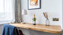 Catch up on emails or work at the convenient desk space.