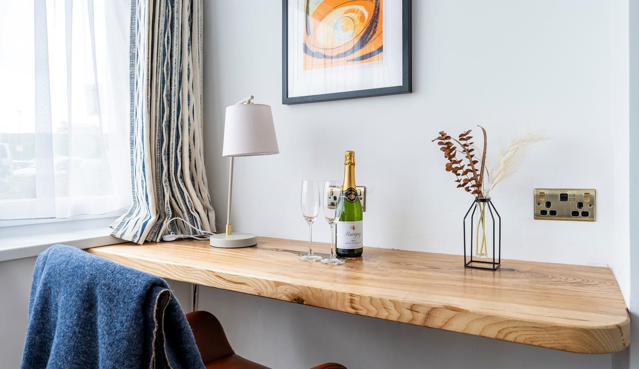 Catch up on emails or work at the convenient desk space.