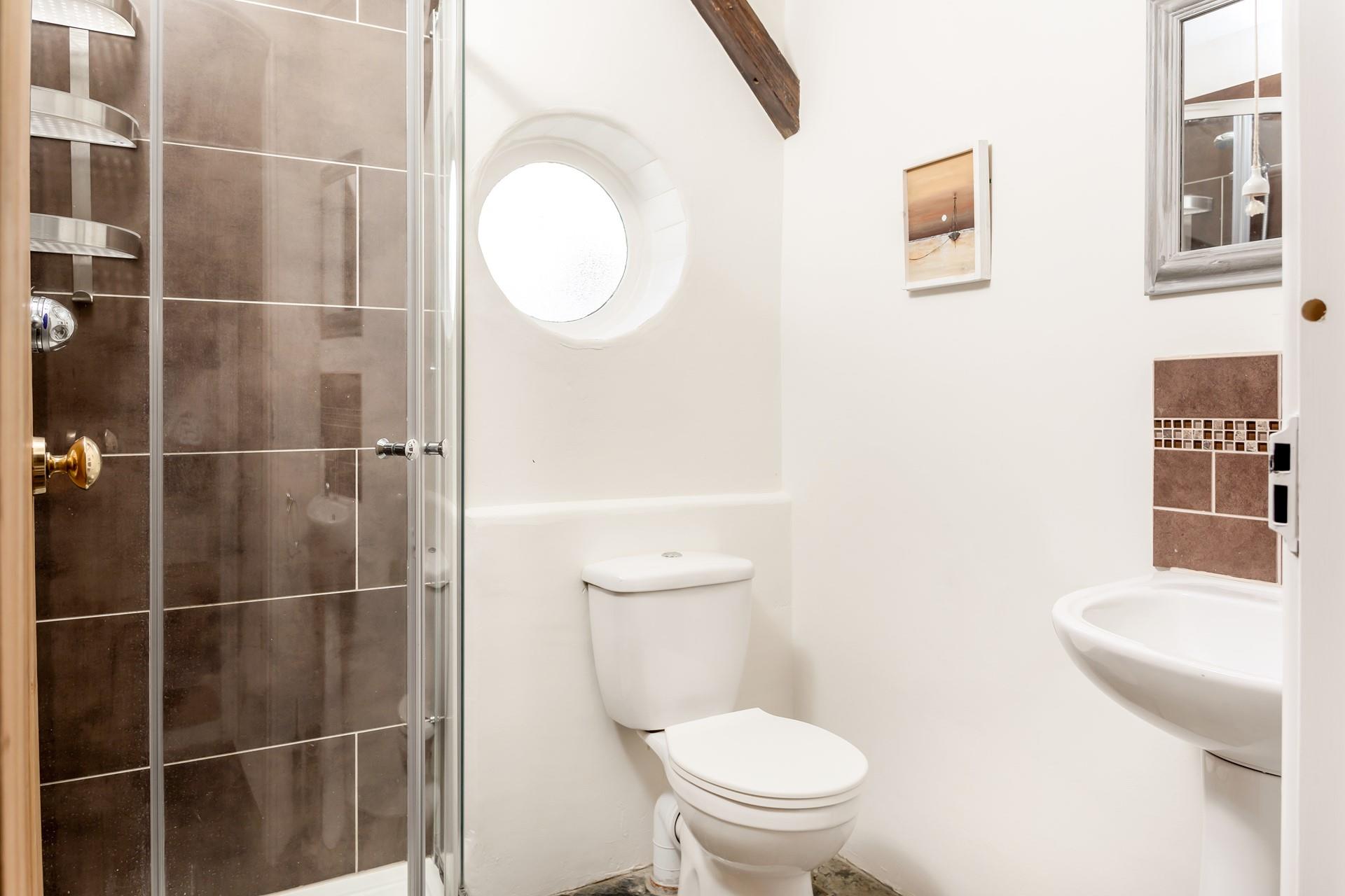 The ground floor shower room is perfect for rinsing off those sandy toes. 