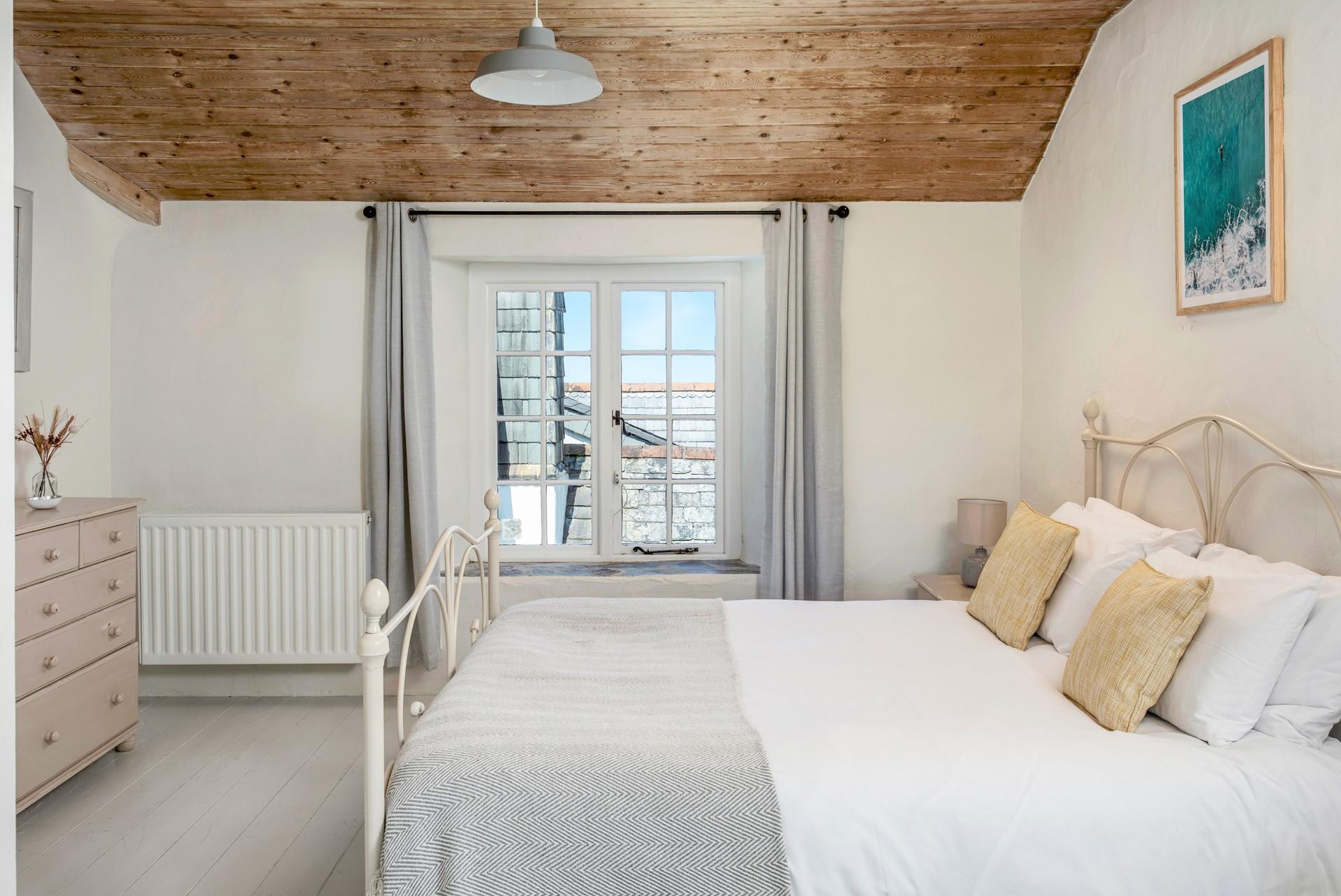 Relax on the soft sheets of the king size bed and drift into a dreamy night's sleep.