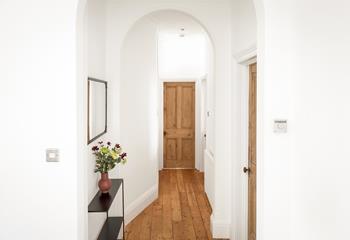 The high ceilings make the space light and spacious, with hard wood flooring throughout the ground floor.