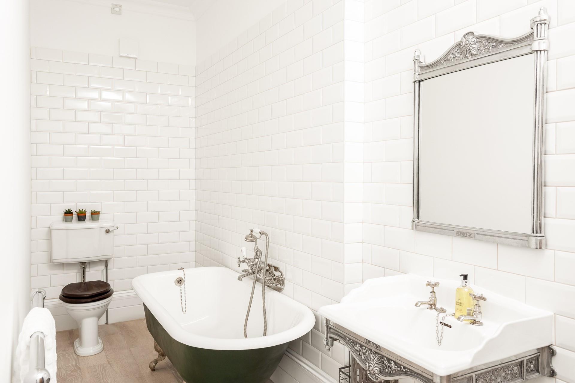 Bedroom 3 has an open en suite, with a roll top bath to relax in and retaining traditional features. 