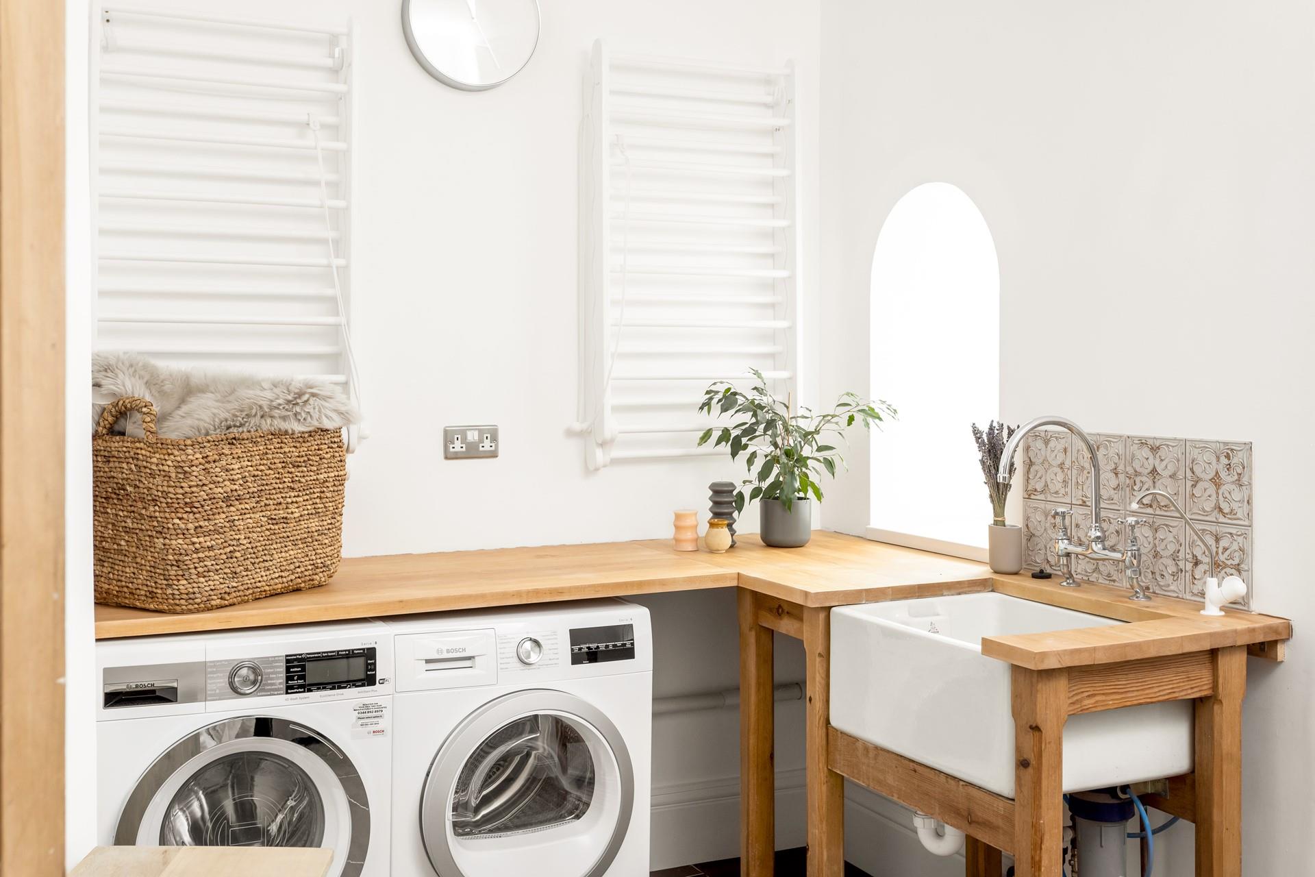 Even the utility room on the ground floor is stylish, with handy wall-mounted clothes airers, as well as a tumble dryer. 