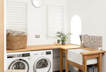Even the utility room on the ground floor is stylish, with handy wall-mounted clothes airers, as well as a tumble dryer. 
