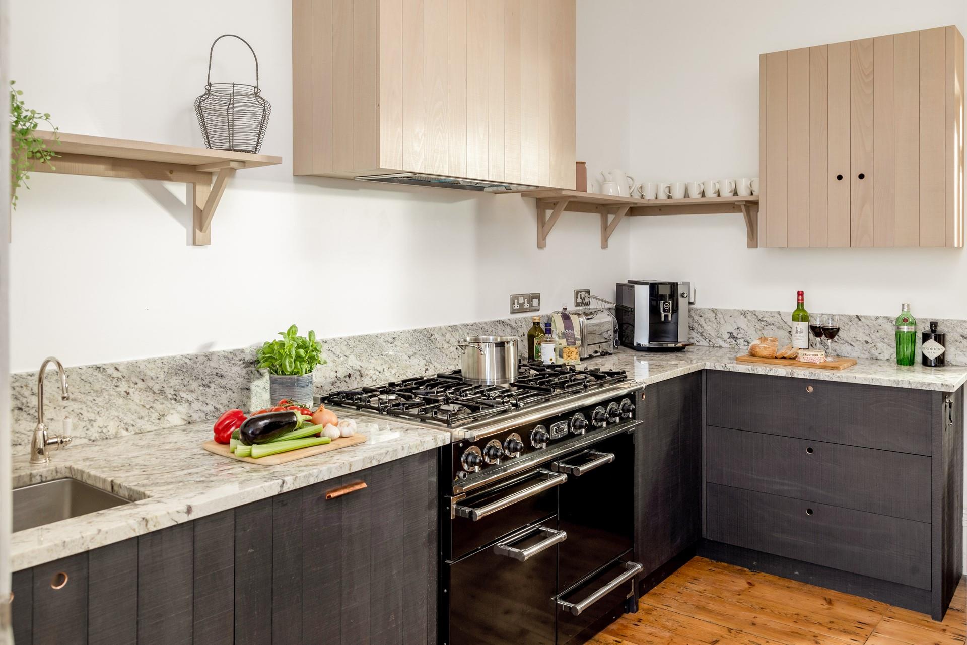 The kitchen is rustic, yet stylish, providing everything you need to make a delicious dinner at home.