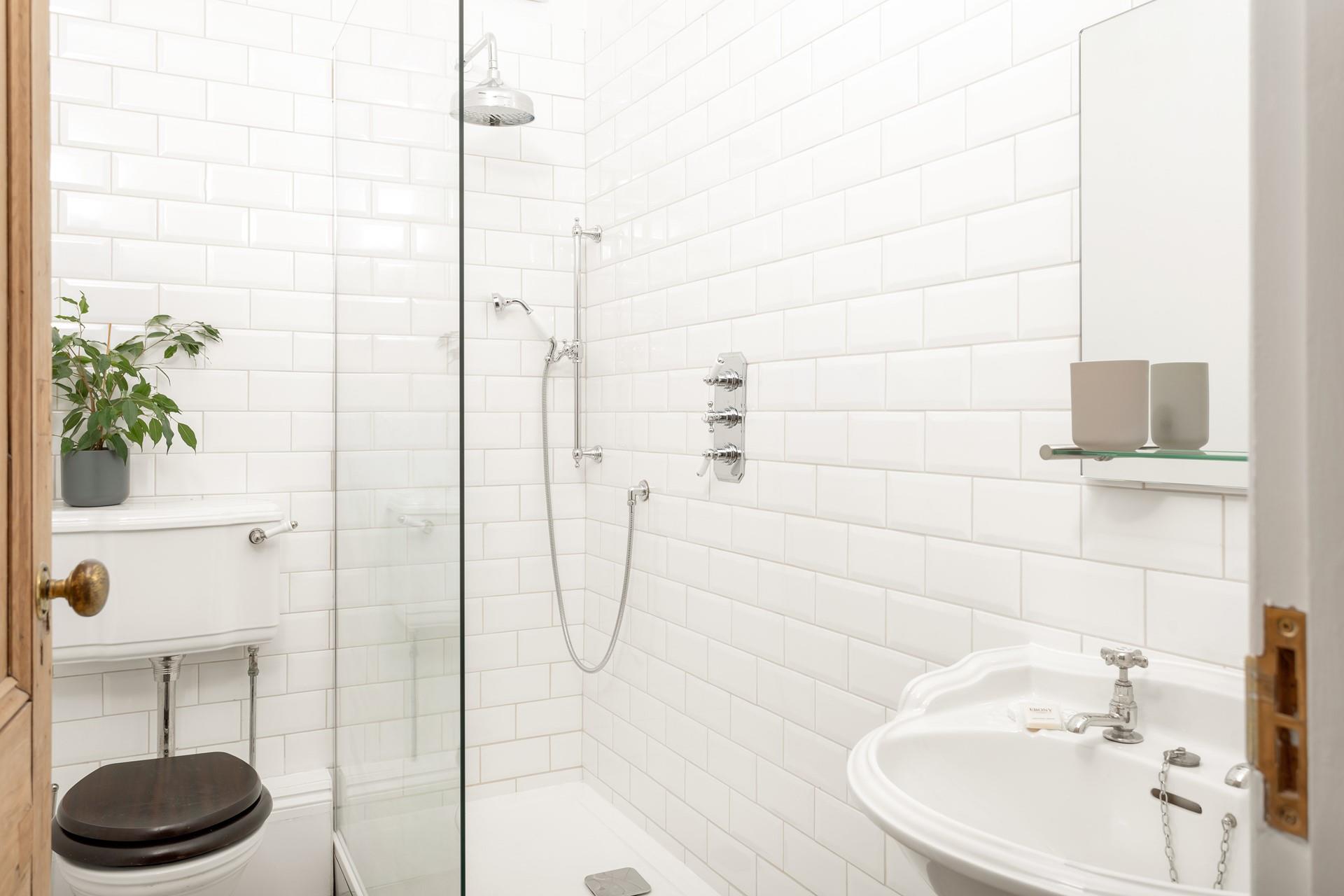 Bedroom 1 on the ground floor has an en suite shower room, with a walk-in double shower with a handy attachment.