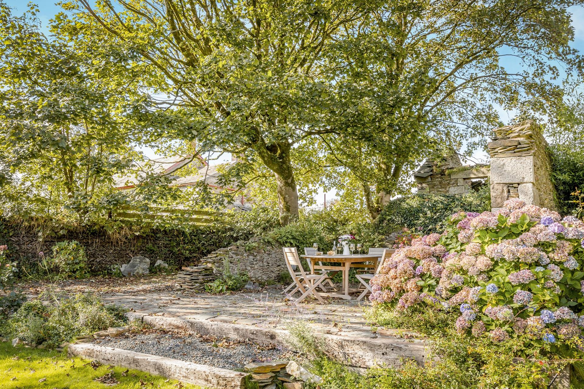 Sip a glass of cold crisp wine under the leafy green trees in the balmy summer months.