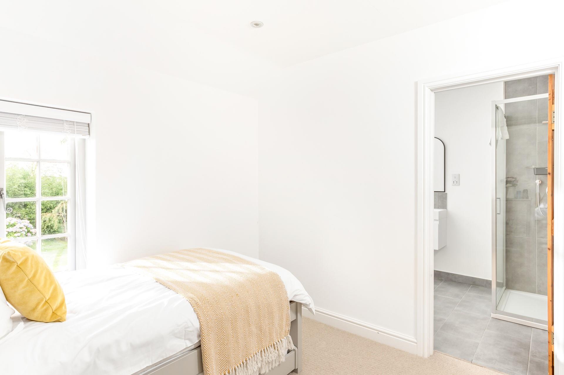 Climb out of bed after a peaceful night's sleep into the en suite to get ready for the day.