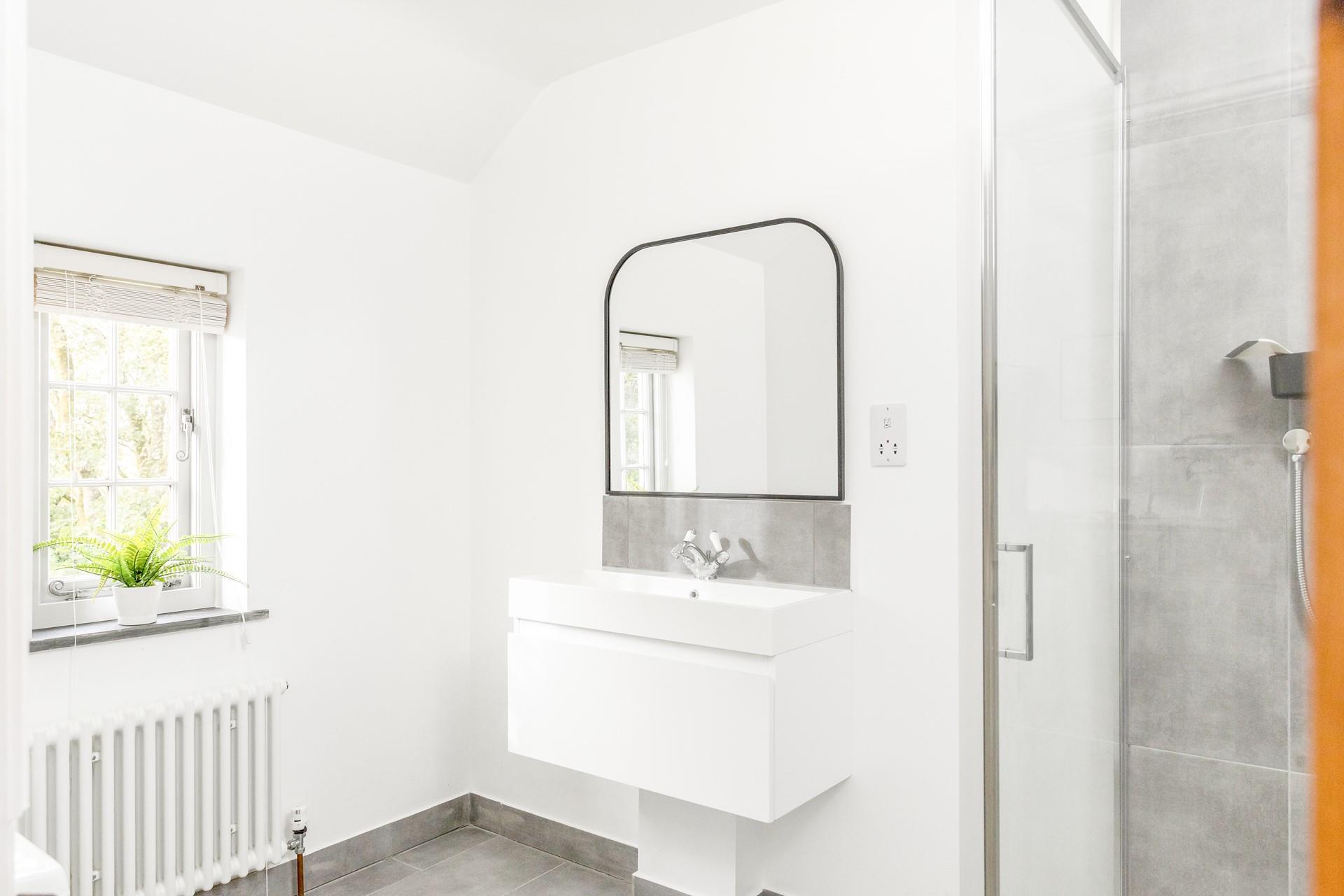 Get ready for the day in the modern en suite.