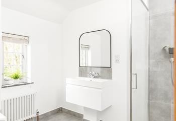 Get ready for the day in the modern en suite.