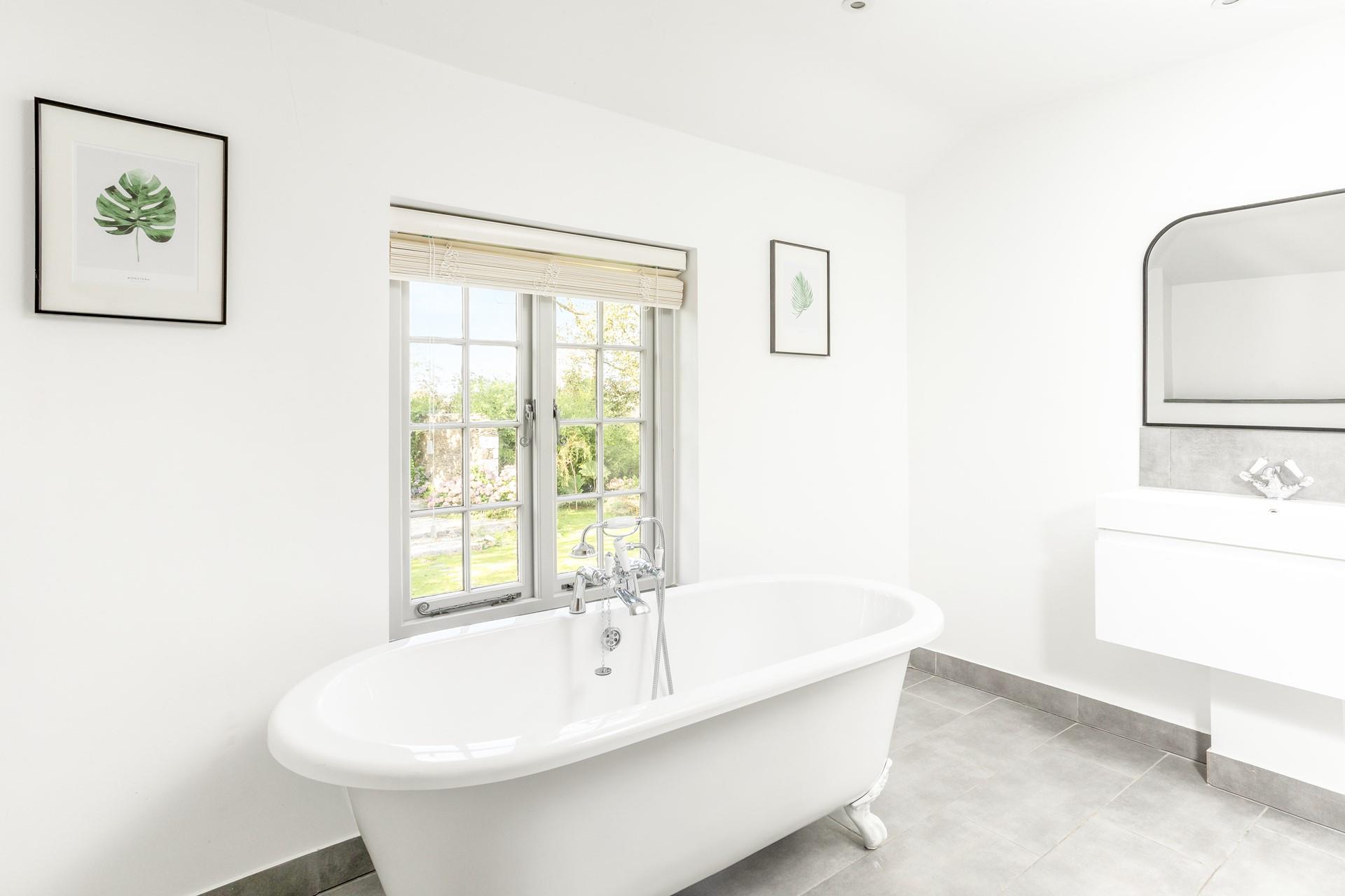 Relax and unwind in the bubbles in the roll-top bath.