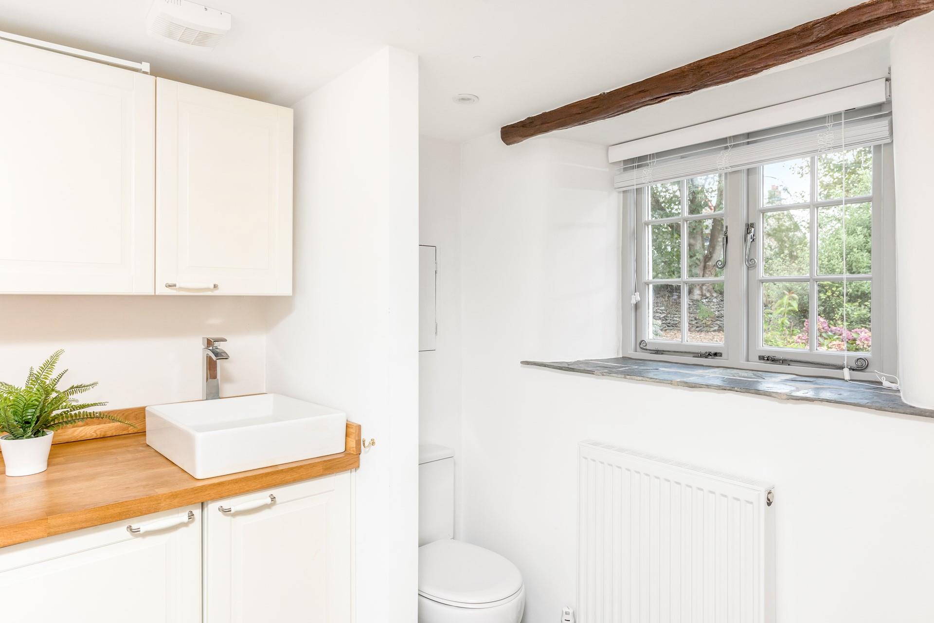 The utility room has an additional WC and basin.