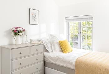 Bedroom 3 overlooks the tranquil leafy garden.