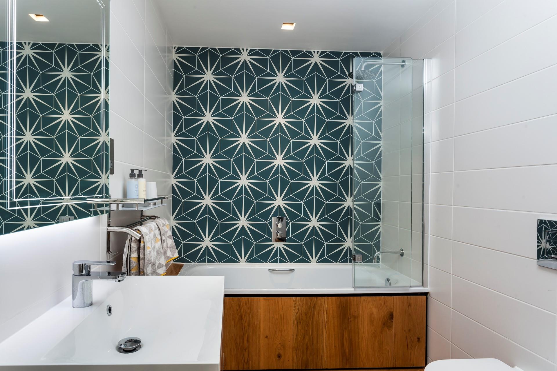 Unique tiles create a striking feature in the bathroom. 
