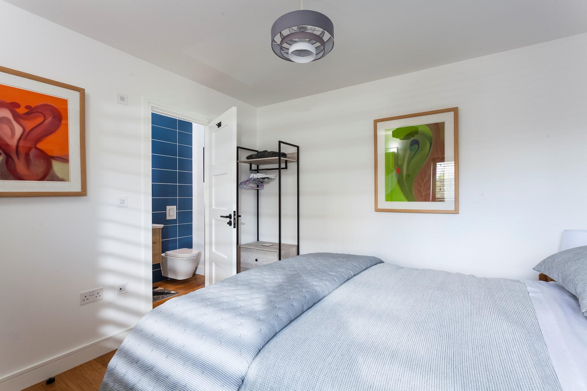 Colourful artwork adds a vibrancy to the room.