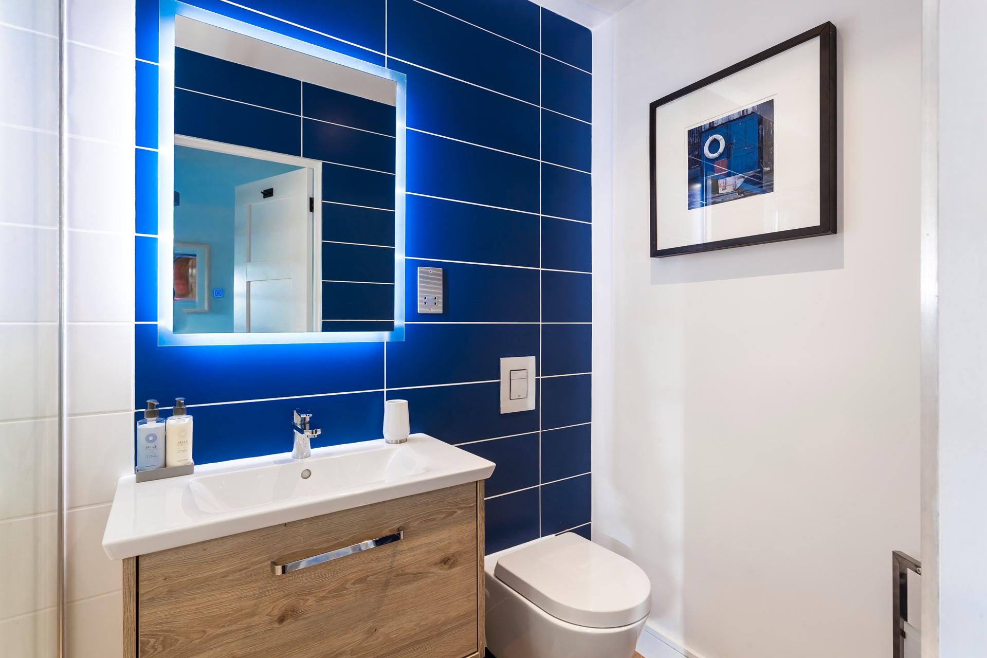 Bedroom 1 benefits from a super stylish en suite shower room. 