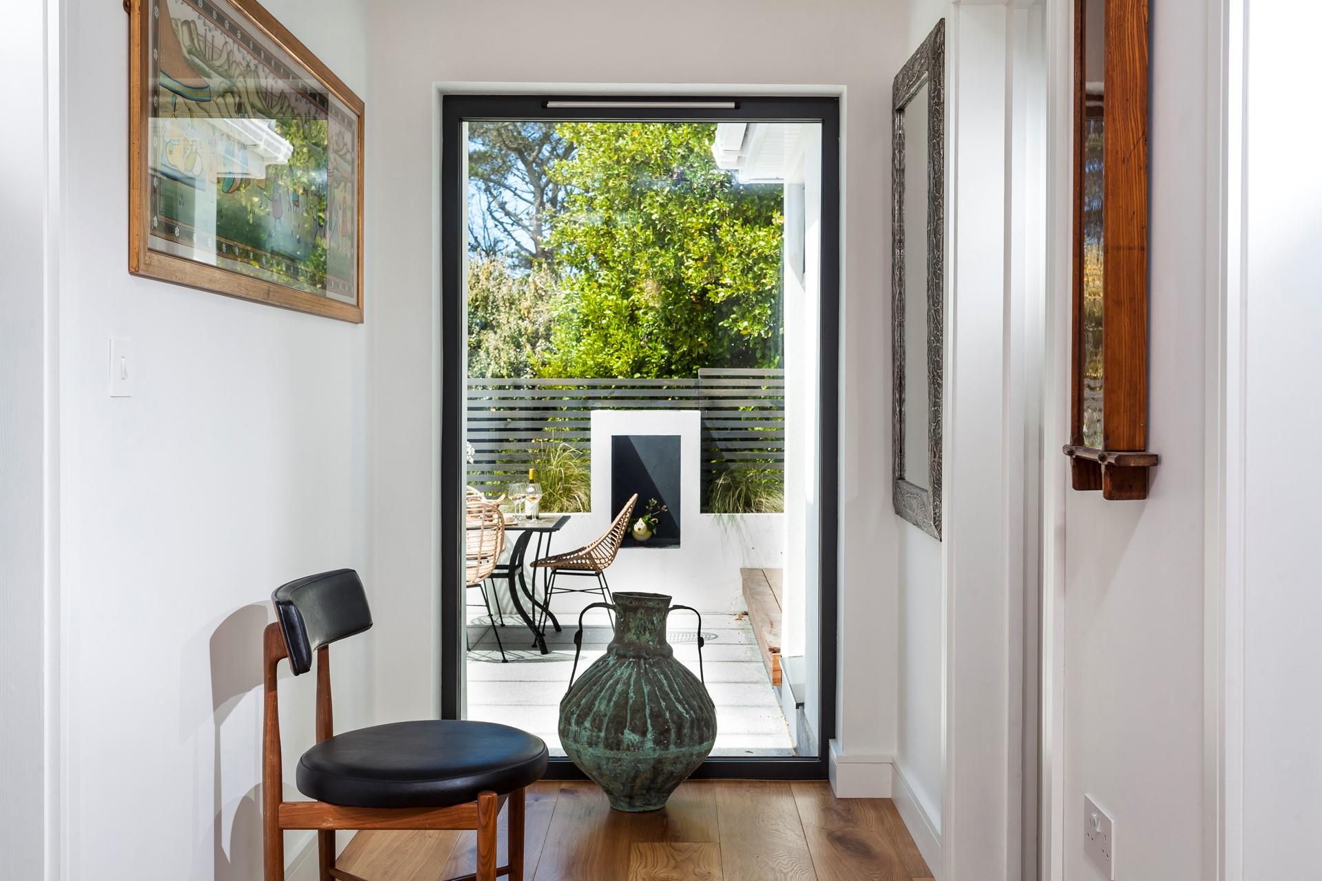 Picture perfect, the large window offers glorious views of the garden and allows natural light to stream into the bedroom. 