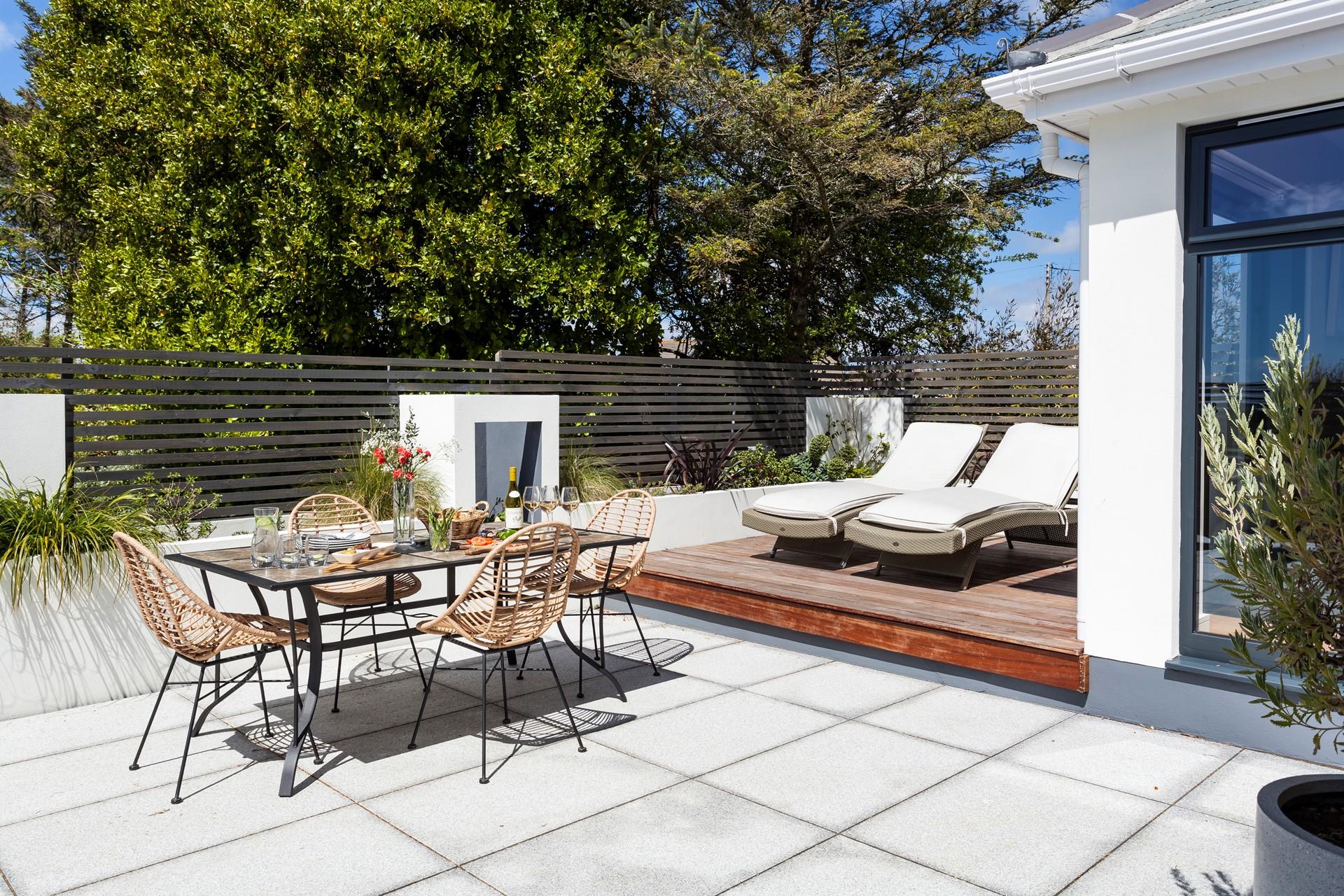 Dine alfresco on the patio, soaking up the sunshine.
