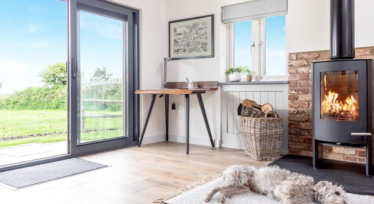 Your four-legged family members will love resting in front of the fire after running around the enclosed garden.