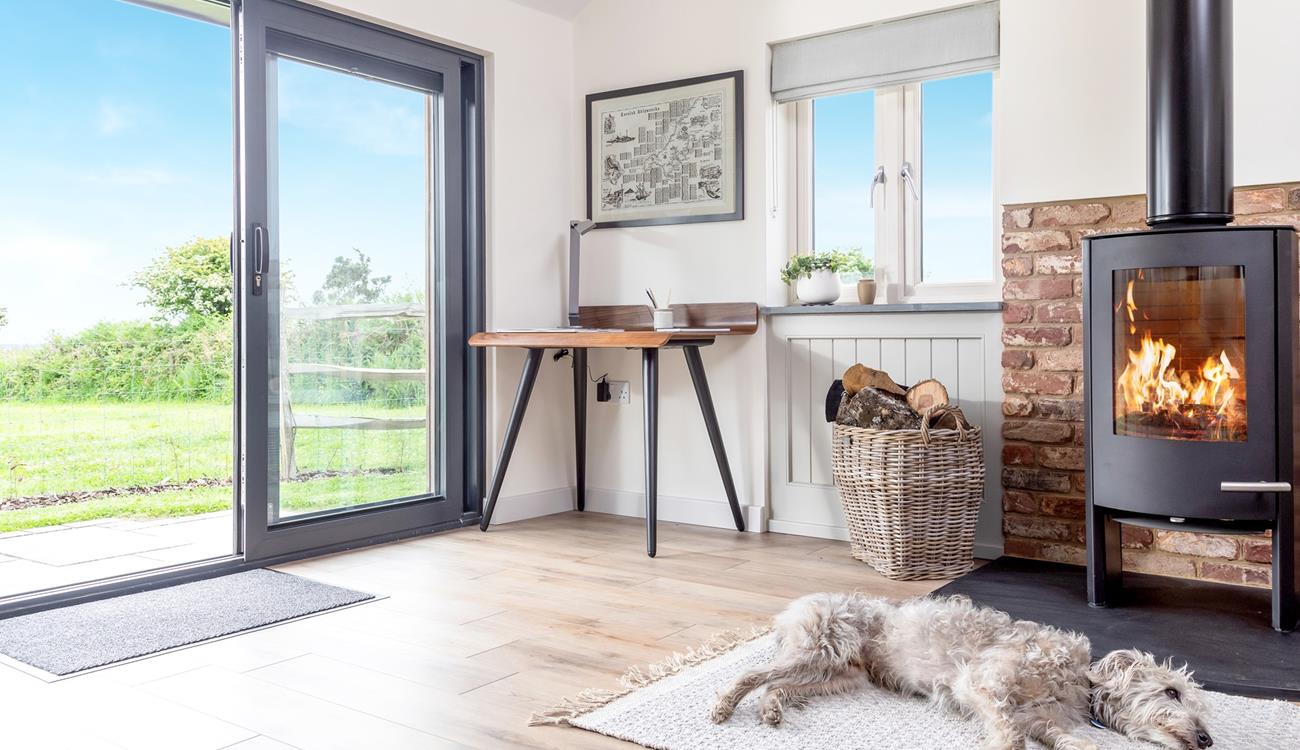 Your four-legged family members will love resting in front of the fire after running around the enclosed garden.