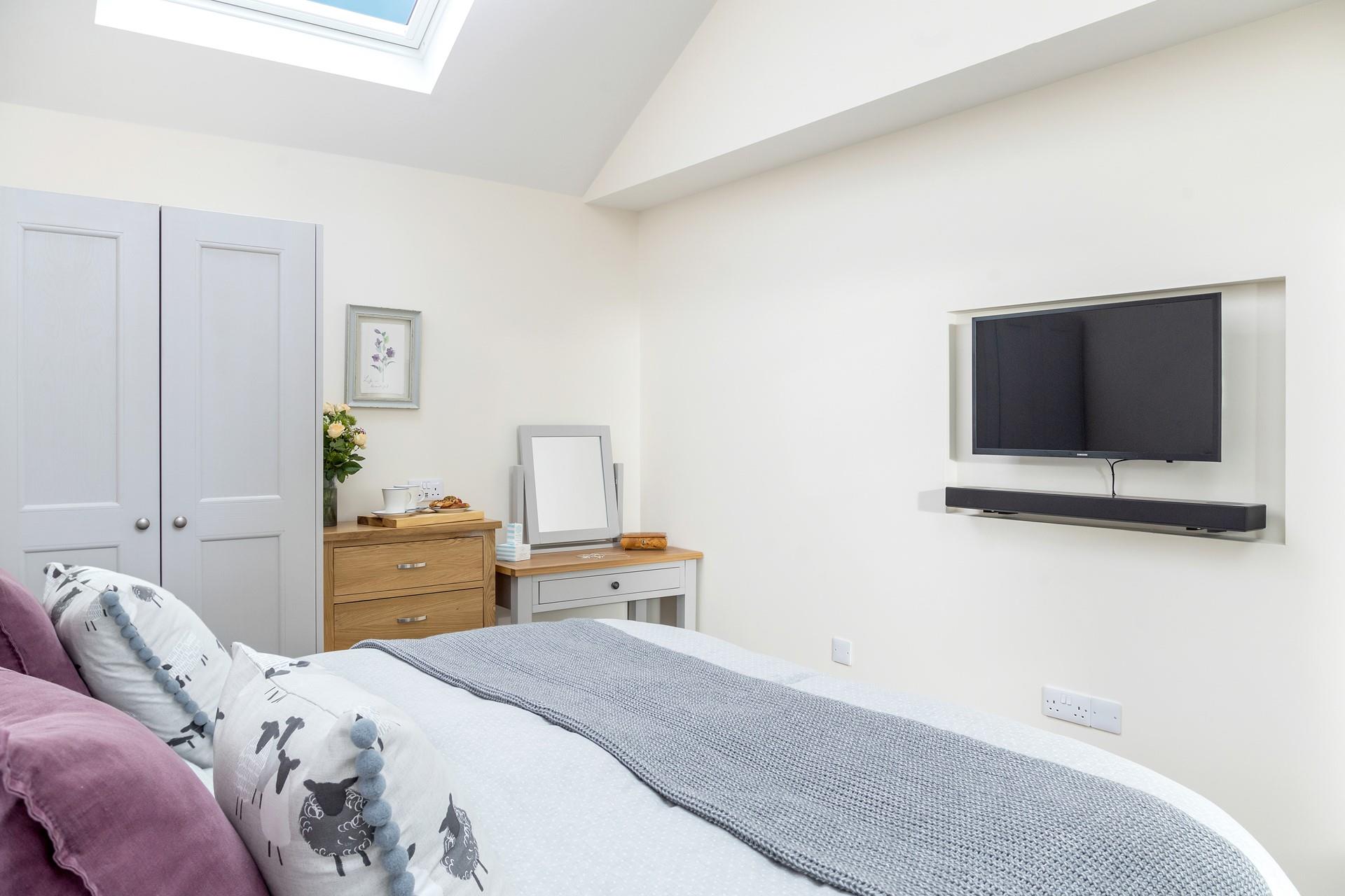 Spend cosy evenings tucked into bed watching films.