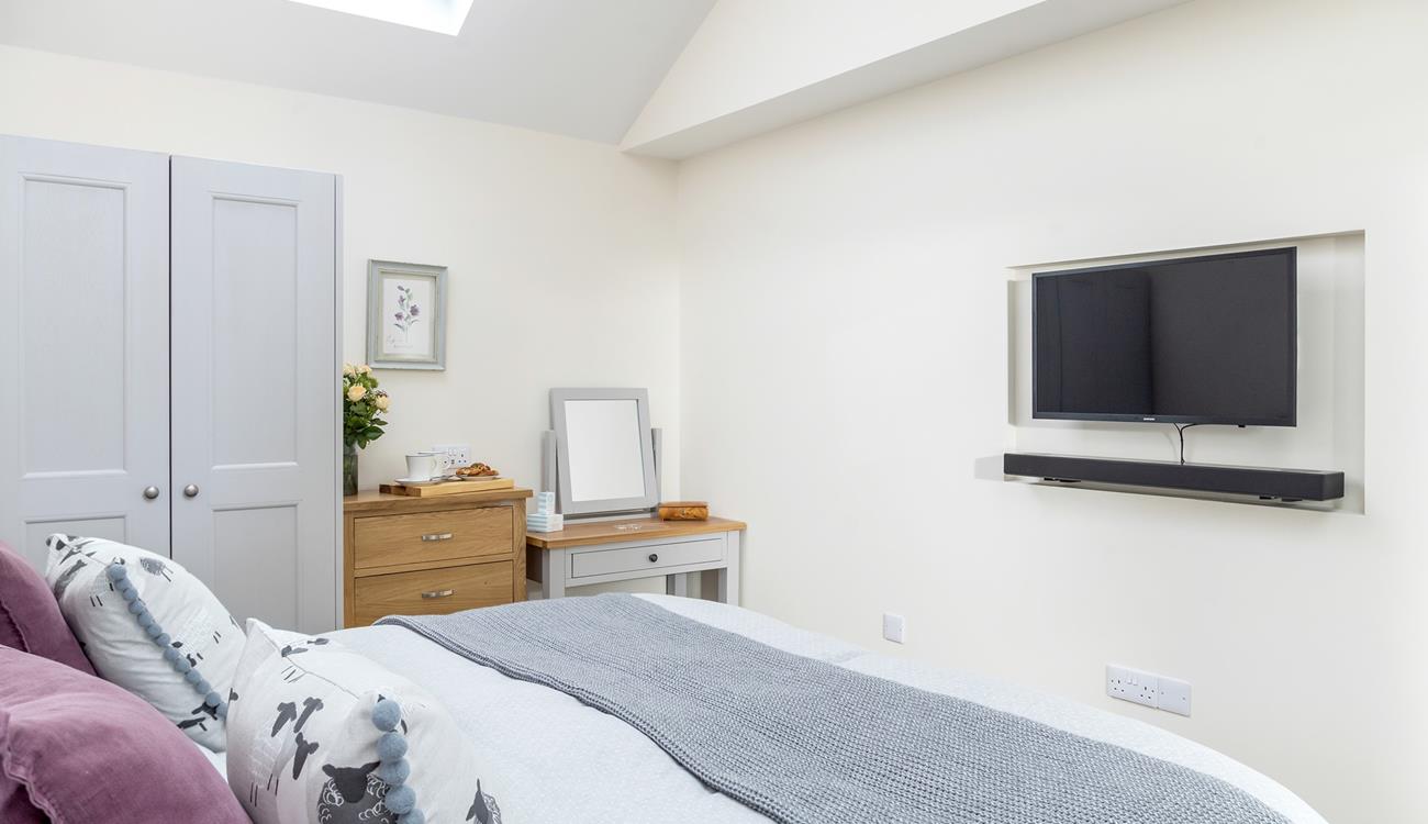 Spend cosy evenings tucked into bed watching films.