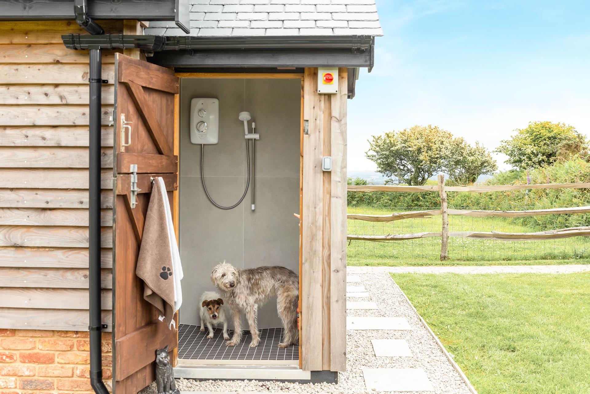 You can give your furry friends a wash after they've had a day of fun in the sand.