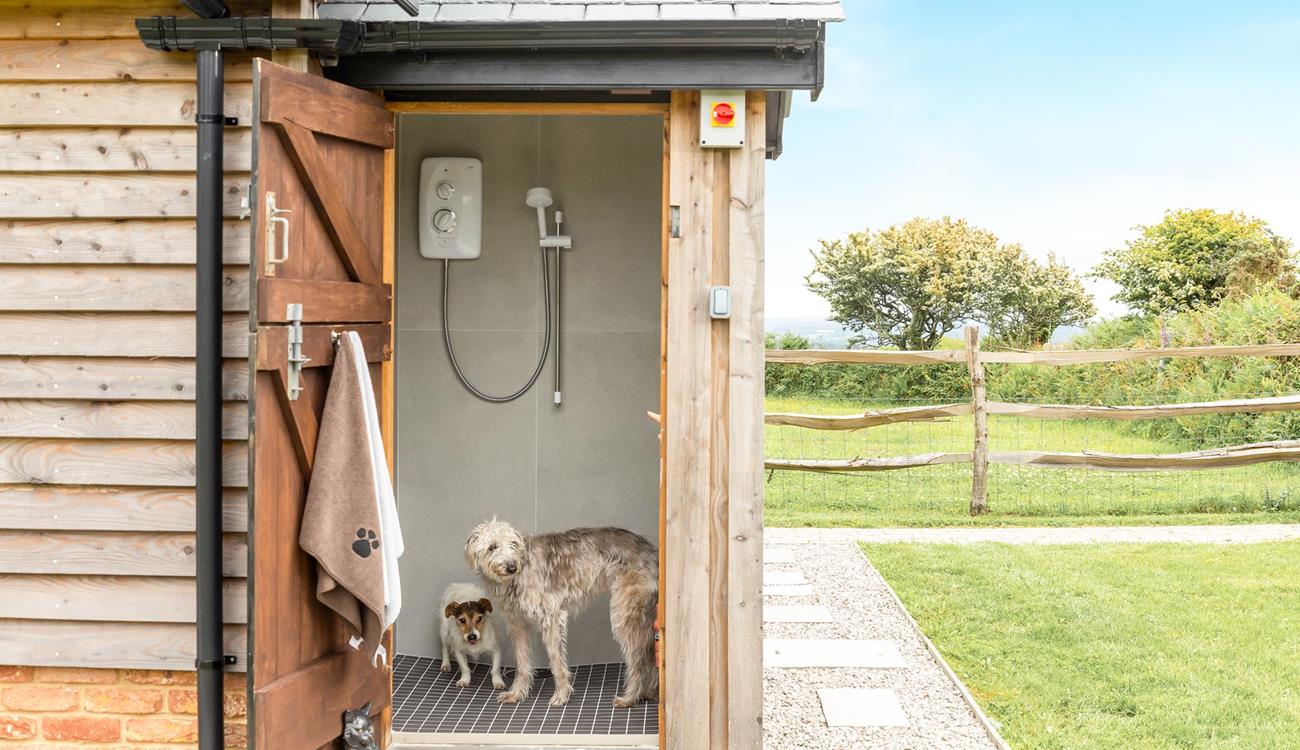 You can give your furry friends a wash after they've had a day of fun in the sand.