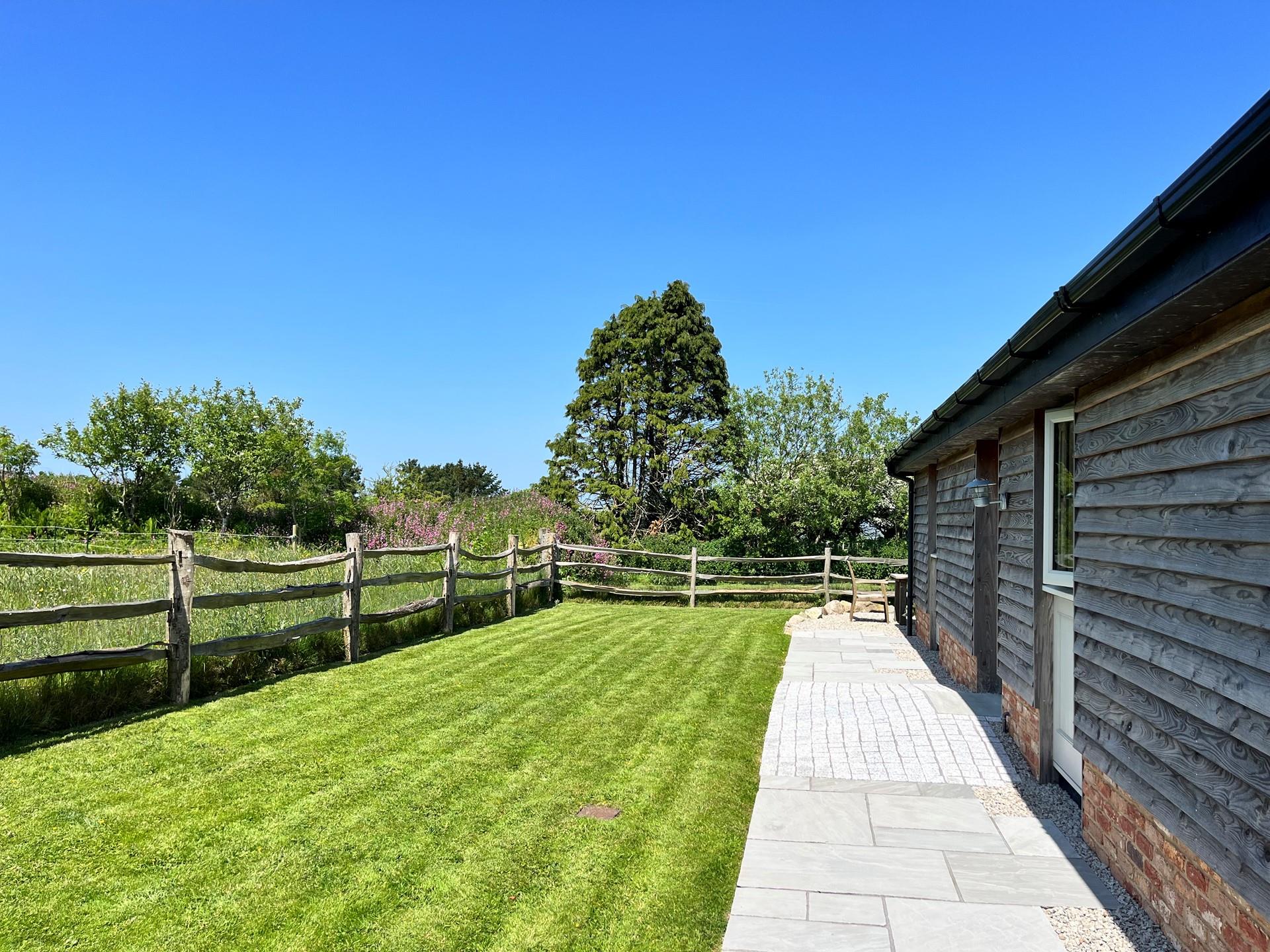 Enjoy the sounds of the countryside in the spacious garden.