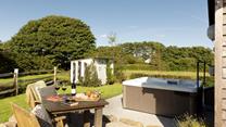 Sink into your bubbling hot tub any time of the day and forget the worries of the world.