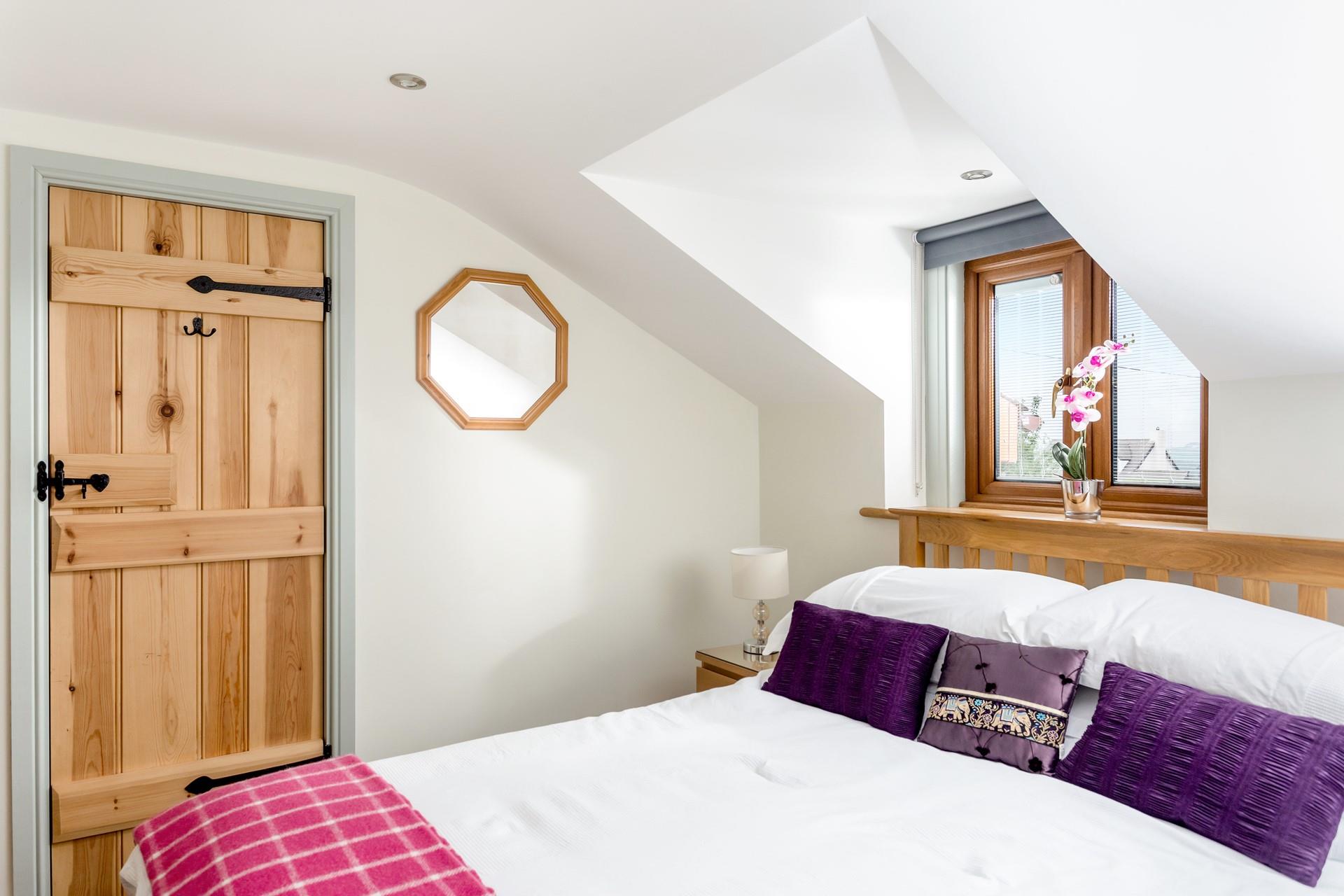 Bedroom 2 is bright and colourful and the king size bed provides a dreamy night's sleep.