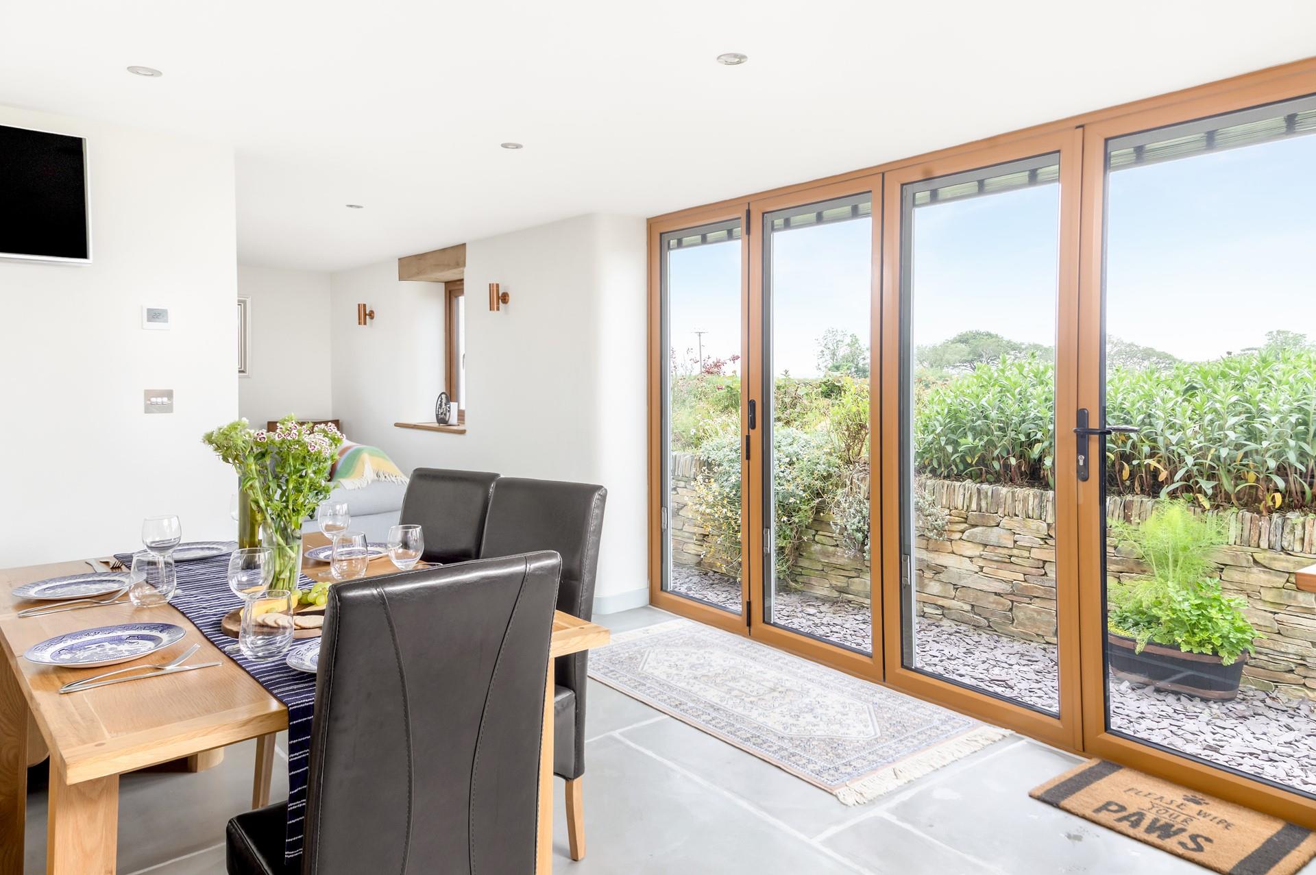 Open the bi-fold doors and let the fresh air run through the cottage.