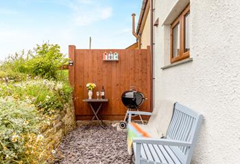 The rear gravelled area has a barbecue, perfect for alfresco dining.