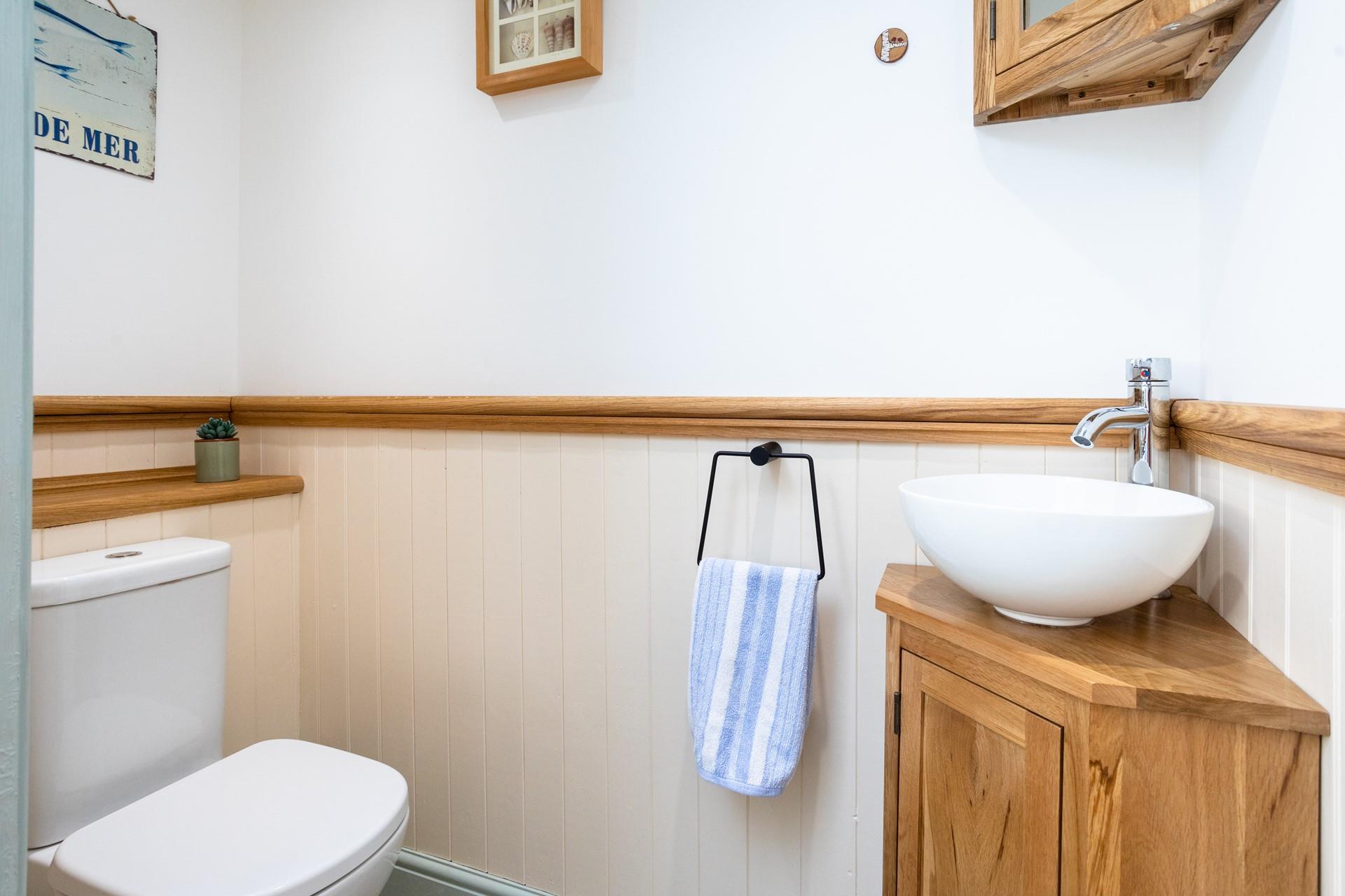 The downstairs cloakroom has an additional WC.