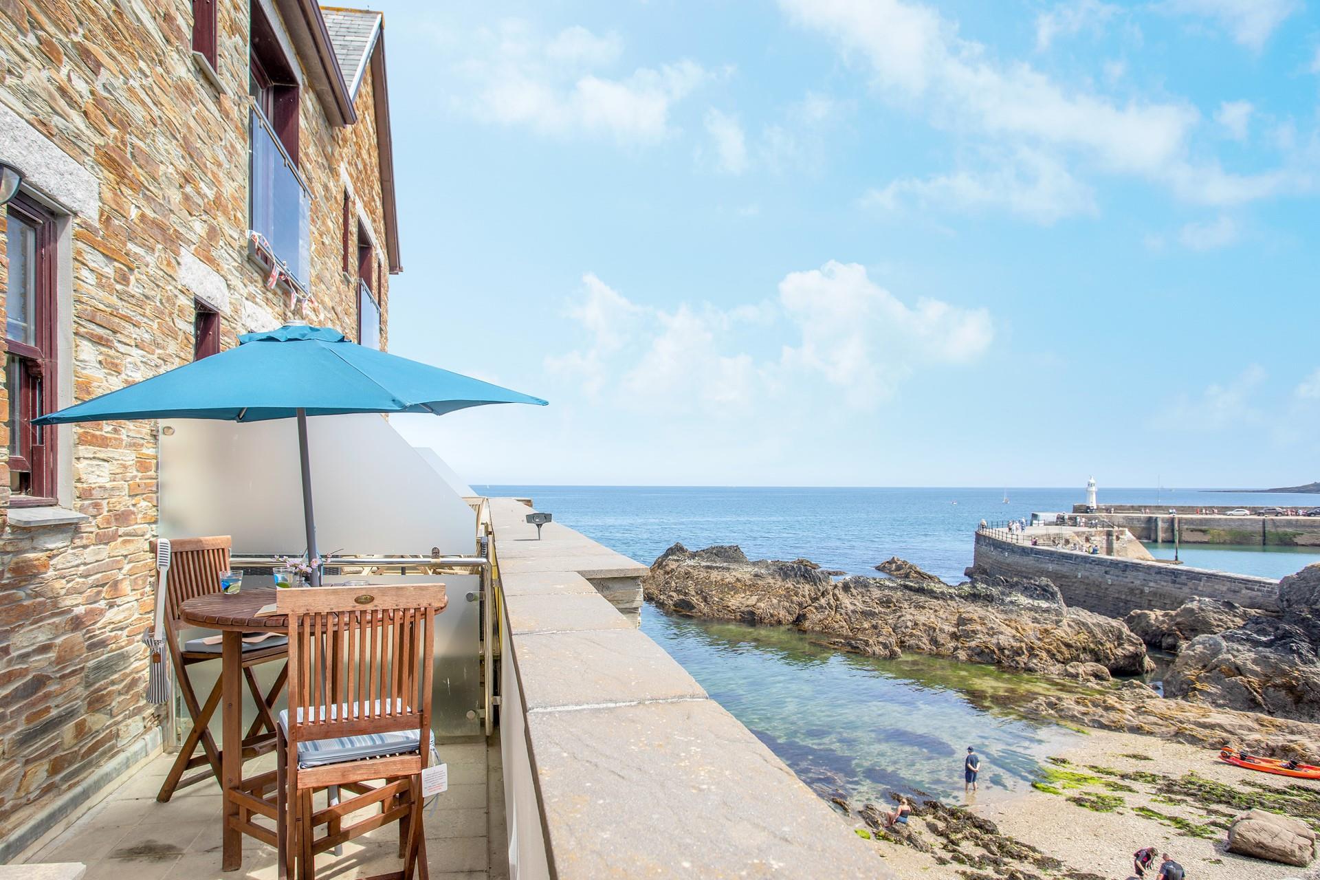 Sit outside with a glass of wine and enjoy watching the boats bobbing in the harbour.