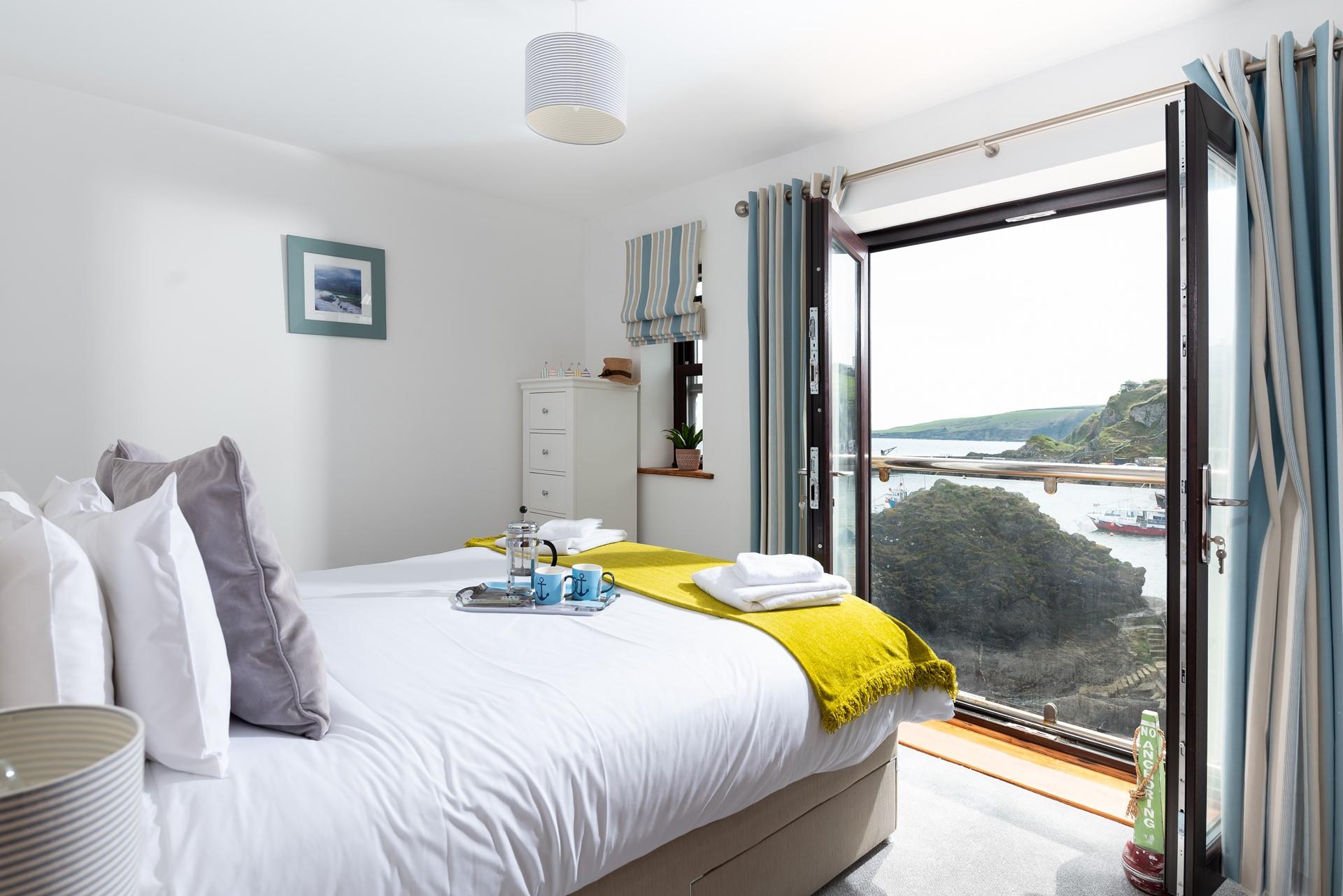 Wake up to stunning views of Mevagissey harbour and sip your morning cuppa as the sun comes up.