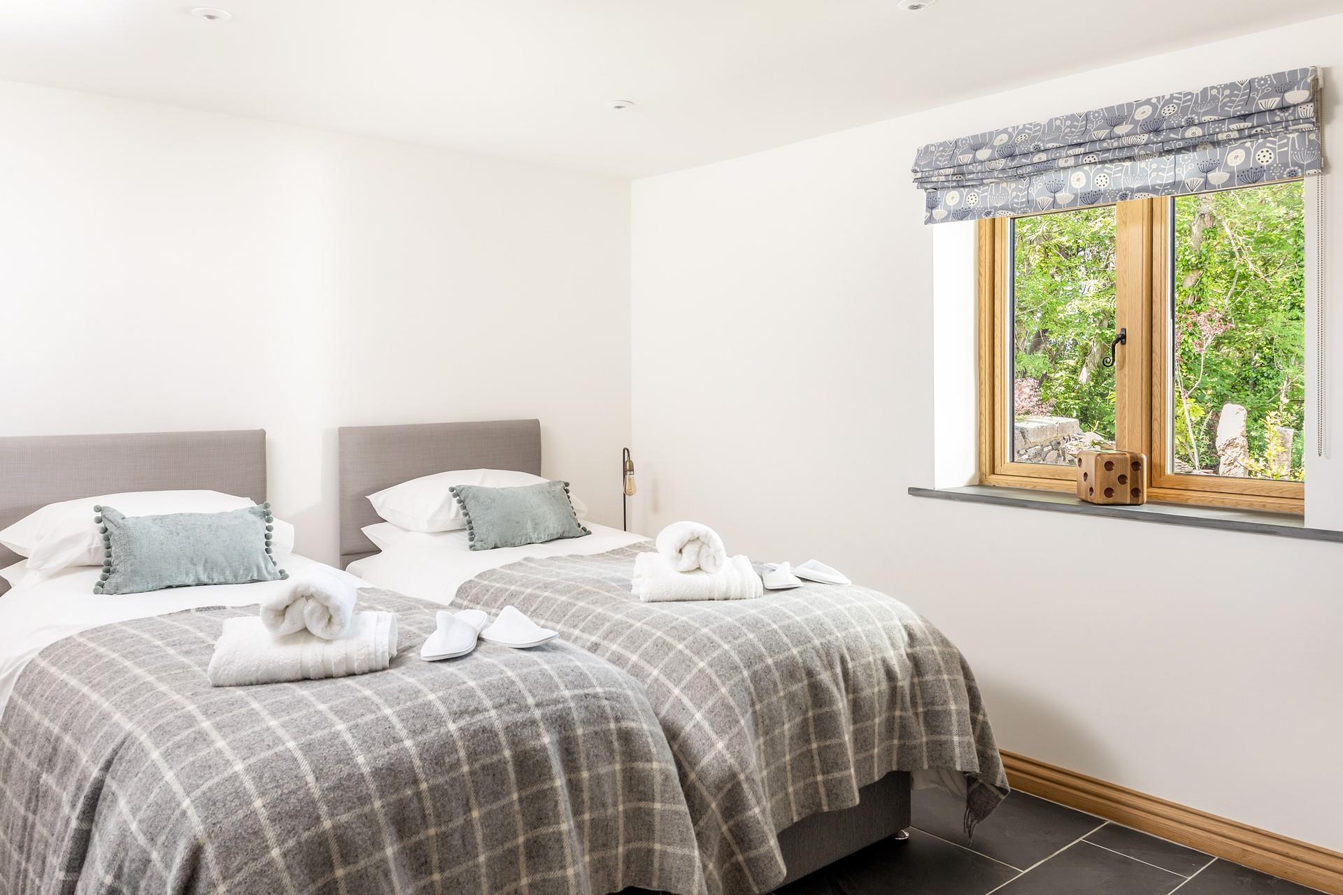 Bedroom 2 has zip and link beds that can be made up as a twin or super king for flexible sleeping arrangements.