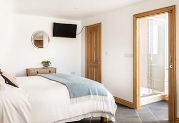 Bedroom 1 has an en suite shower room and a sumptuous king size bed.