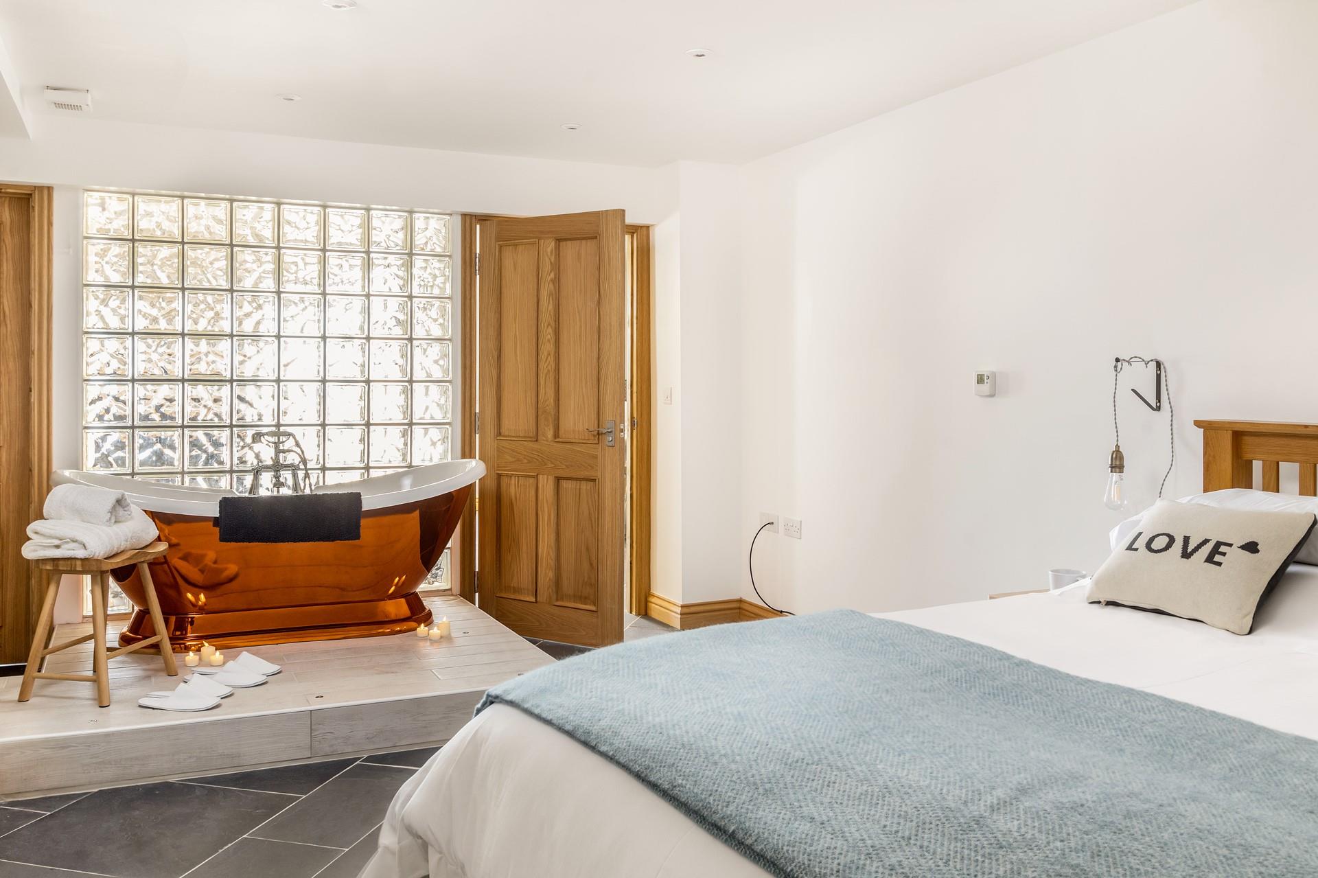Bedroom 1 has a gorgeous copper bath and king size bed, complete with dressing gowns and slippers, pure luxury!