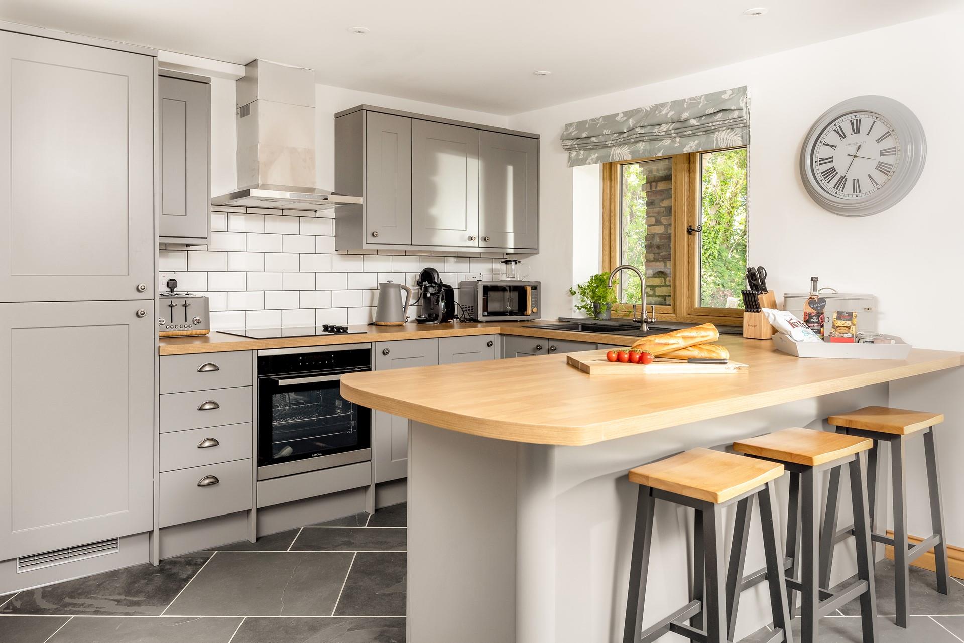 The kitchen is well-equipped with all the necessary appliances to cook a tasty meal.