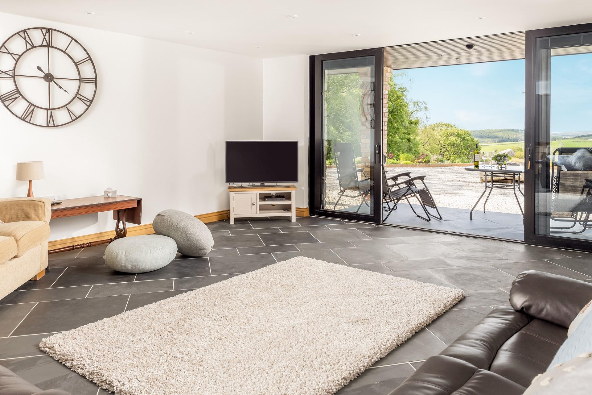 Enjoy the peace and tranquillity of the countryside from the sitting room.