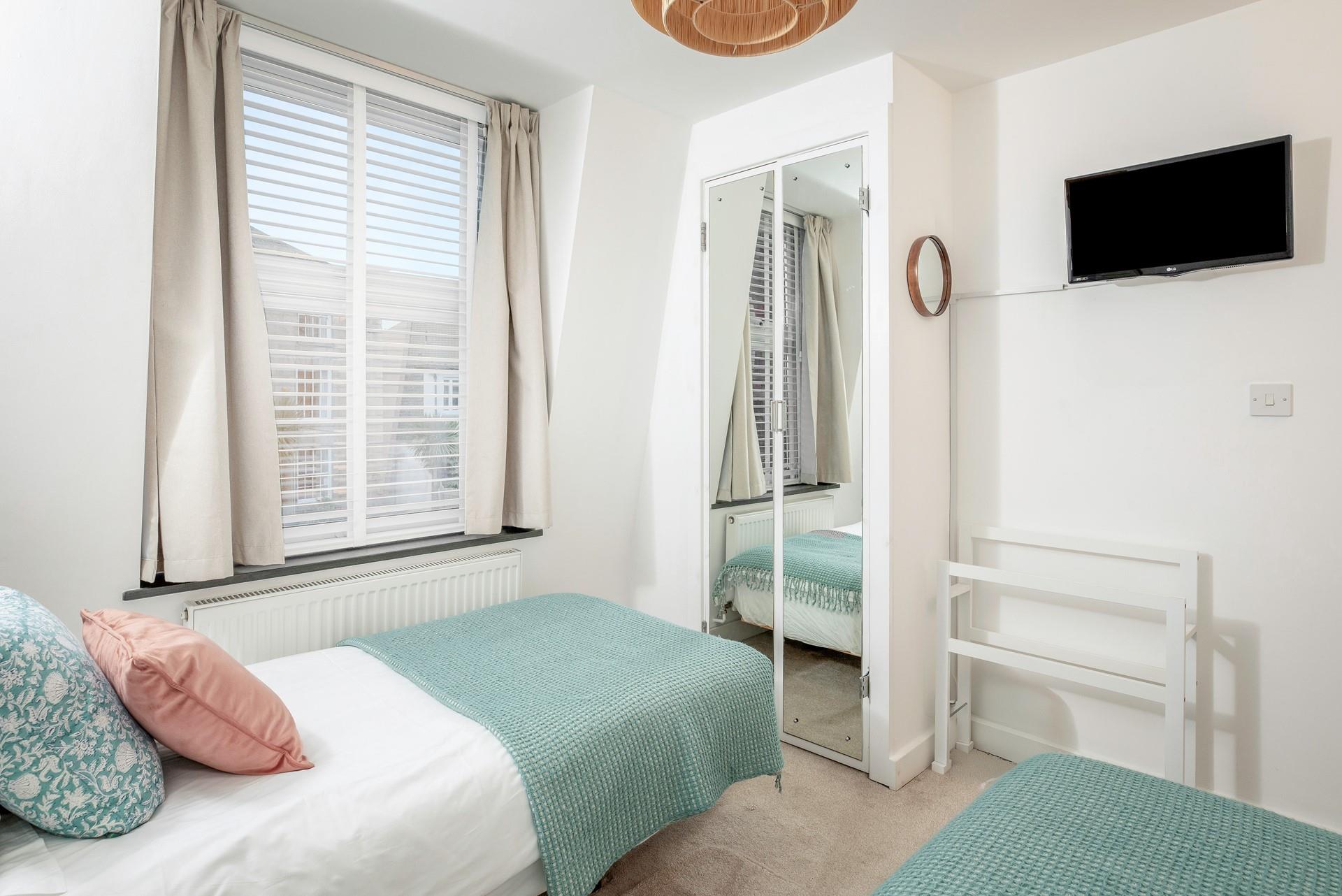 The bedrooms are decorated with calming tones.